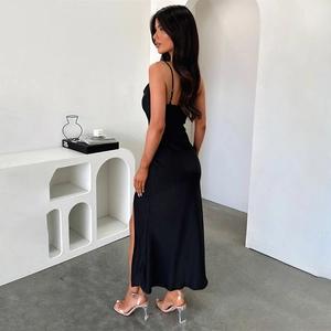 Detail view of black satin evening dress with a high side slit and slim fit silhouette