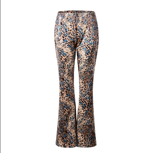 Detail view of high-waist flared pants with leopard print and blue accents in soft stretch