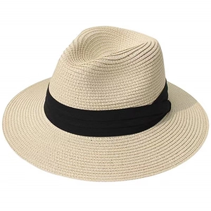 Close-up of tight straw weave texture and black ribbon detail on beige fedora sun hat