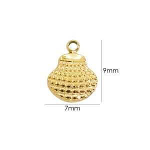 Detailed macro view of a 9mm x 7mm gold shell charm with textured grid pattern surface