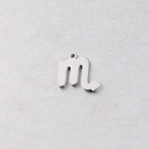 Detailed macro view of silver mirror-finish Scorpio zodiac pendant with top hole charm