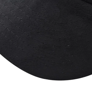 Detailed macro view of black cotton baseball cap brim with six rows of reinforced stitching