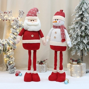 Detail of Christmas Santa and Snowman plush with telescopic legs on festive background