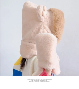 Detail of plush winter hooded scarf with bear ears and thick faux fur texture