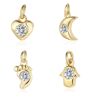 Polished gold Hamsa, moon, heart, and footprint pendants set with clear zircon stones