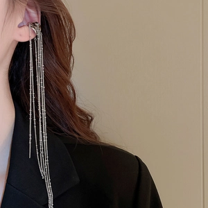 Elegant silver tassel ear cuff with long chains on model for non-pierced ears