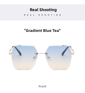 Front view of rimless square sunglasses with blue-brown gradient lenses and gold metal frame