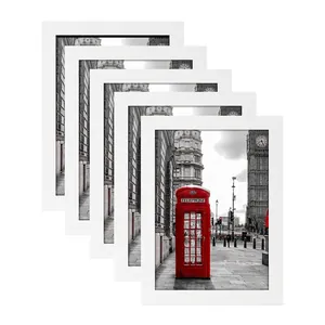Set of 5 minimalist white picture frames featuring London red telephone box art prints