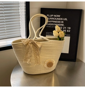 Close-up of handmade woven tote bag featuring a 3D sunflower and delicate lace bow detail