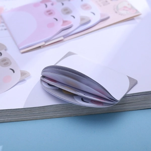Cute cartoon pig sticky notes set in various colors on a blue background