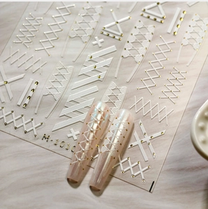 Detailed 5D relief nail stickers M-1010 featuring white woven textures and golden accents