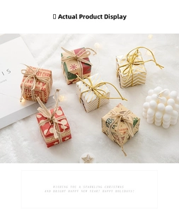 Detailed view of six mini Christmas gift boxes with festive patterns on white plush background