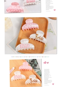 Detail of pink and white Bride claw clips with gold glitter lettering and crown patterns