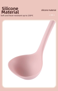Close-up of pink food-grade silicone soup spoon showing soft heat-resistant 230C material
