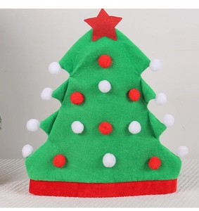 Detail of Christmas tree shaped party hat with plush red star and colorful pom-poms