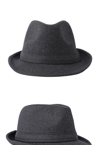 Detailed macro view of dark grey wool felt fedora showing thick fabric texture and quality