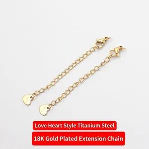 Detail of 18K gold-plated titanium steel extension chains with heart charms and lobster clasps
