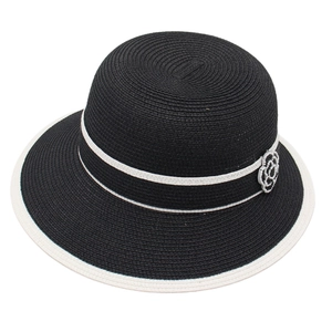 Women's black woven straw sun hat with white flower detail and contrasting trim