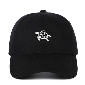 Classic black cotton baseball cap featuring white sea turtle embroidery on front panel