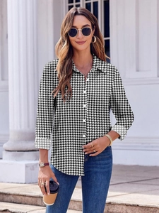 Woman in lapel long sleeve shirt with classic black and white houndstooth pattern print