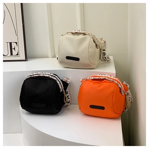 Modern nylon crossbody shell bags in beige, black and orange with embroidered straps