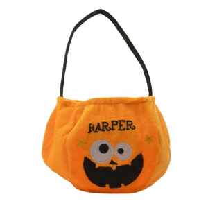 Orange velvet Halloween pumpkin candy bag with embroidered eyes and Harper detail