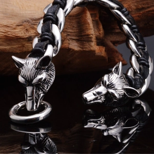 Black leather bracelet with dual 316L stainless steel wolf heads and ring closure