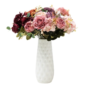 Artificial hibiscus rose bouquet in white textured vase for home wedding decor