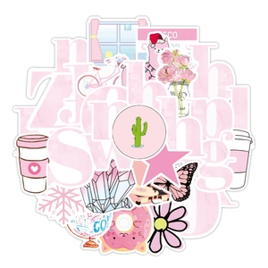 Close-up of cute pink VSCO stickers featuring cactus, coffee and cats for DIY scrapbooking