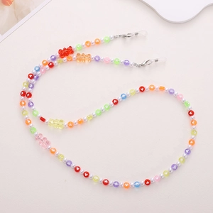 Detailed view of colorful beaded eyewear chain with small resin bear charms and pearls