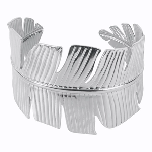 Detailed view of leaf shaped silver metal open bangle with textured vertical patterns