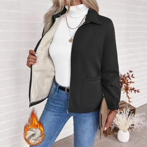 Detail of black lapel jacket with cream fleece lining and functional large pockets