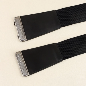 Women's vintage black elastic waist cinch belt with engraved silver metal buckle