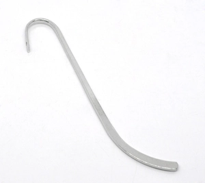 Close-up of a sleek silver-plated metal bookmark accessory with a curved hook design