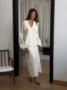 Elegant ivory white two-piece knit set with V-neck cardigan and matching long skirt