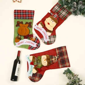 Three large Christmas stockings featuring Santa, reindeer, and snowman in plaid festive style