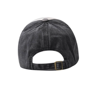 Close-up of vintage washed denim baseball cap back with adjustable bronze metal buckle