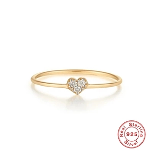 Polished S925 sterling silver heart ring with sparkling crystals on white background