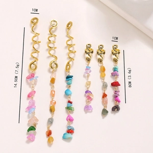 Detail view of golden spiral hair rings with natural stone pendants and specific dimensions