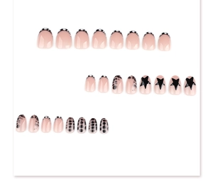 Detailed flat lay of y2k leopard print and star patterns on short round press-on nails