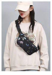 Professional model wearing black oxford waist bag across chest with adjustable strap