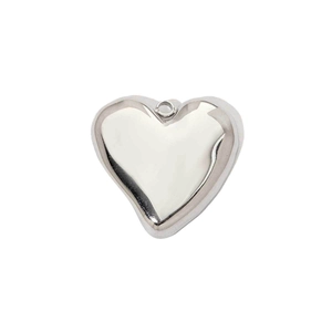 Close-up of polished silver heart-shaped pendant in stainless steel with a top loop