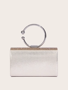 Sparkling silver evening clutch bag with crystal handle and glittery finish for weddings