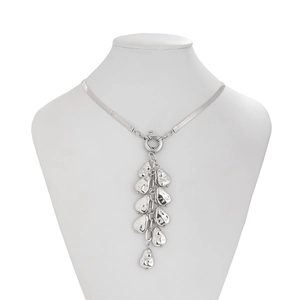 Detail of silver snake chain necklace featuring clustered liquid metal fringe pendants