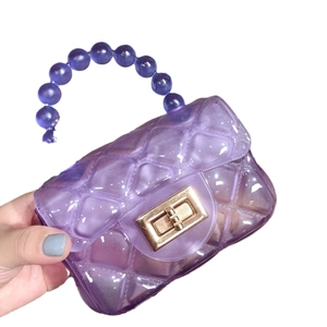 Modern purple transparent jelly bag with quilted pattern and beaded handle for women