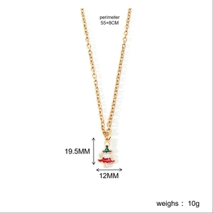 Detailed close-up of a Christmas tree pendant on a gold chain with precise measurements