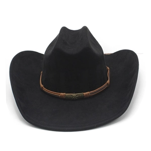 Detail of black suede cowboy hat featuring brown braided leather band and skull charm
