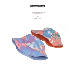 Detailed view of colorful tie-dye bucket hats with vibrant swirl patterns and cotton texture