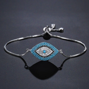 Macro shot of blue Evil Eye bracelet with pavé zircons and adjustable sliding silver chain