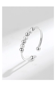 Macro detail of S925 sterling silver beads showing polished and frosted textures on the ring